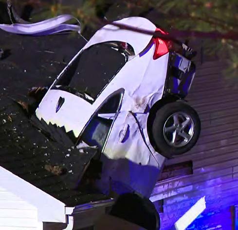 car plunges through roof