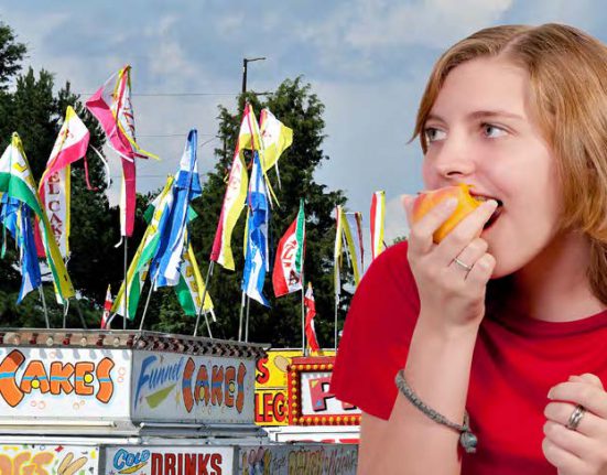 Woman eating candy apple