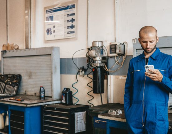 employee scrolling on phone at work