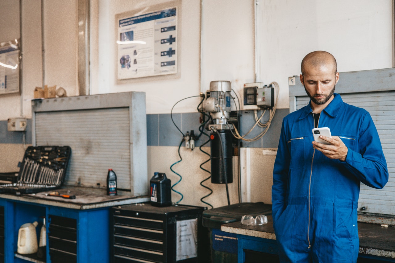 employee scrolling on phone at work