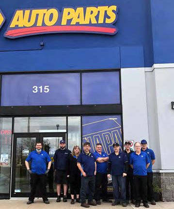 Napa employees standing in front of Napa Auto Parts