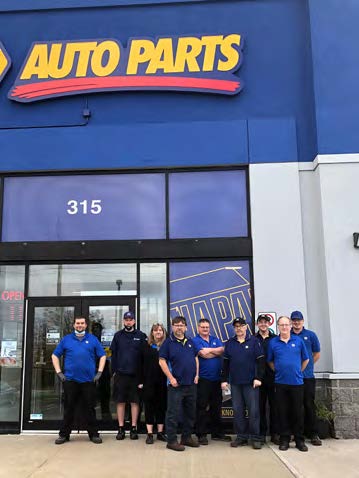 Napa employees standing in front of Napa Auto Parts