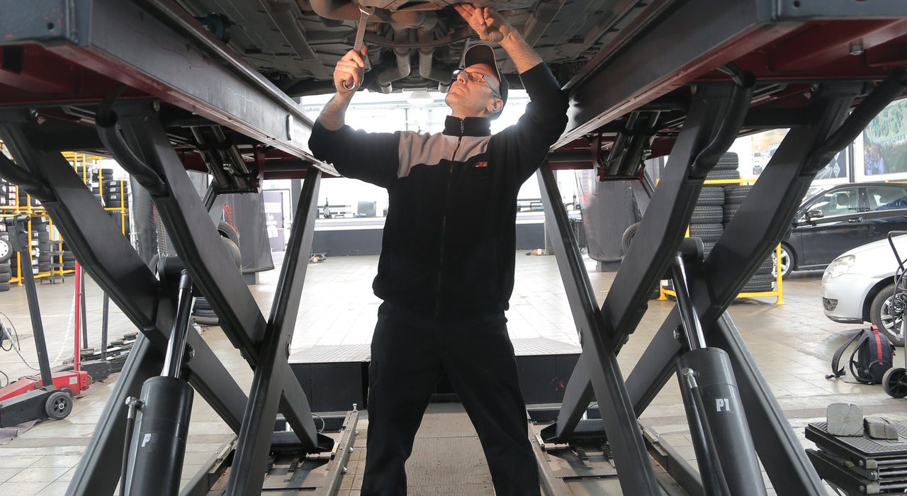 Man working under car