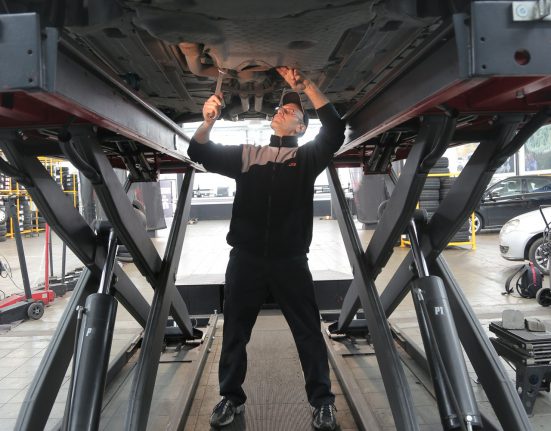 Man working under car