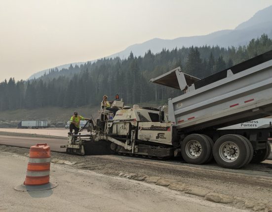 Highway workers with dumptruck