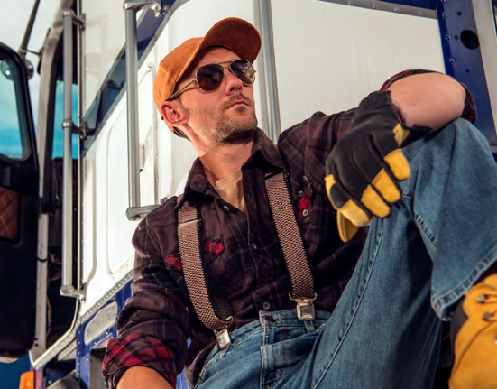 Man sitting beside truck