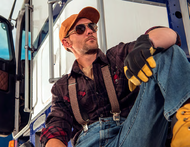 Man sitting beside truck