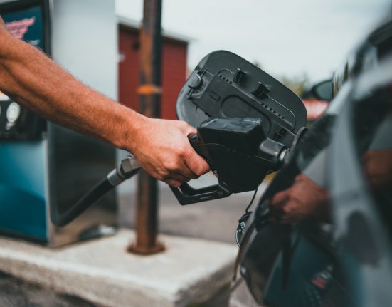 Man pumping gas