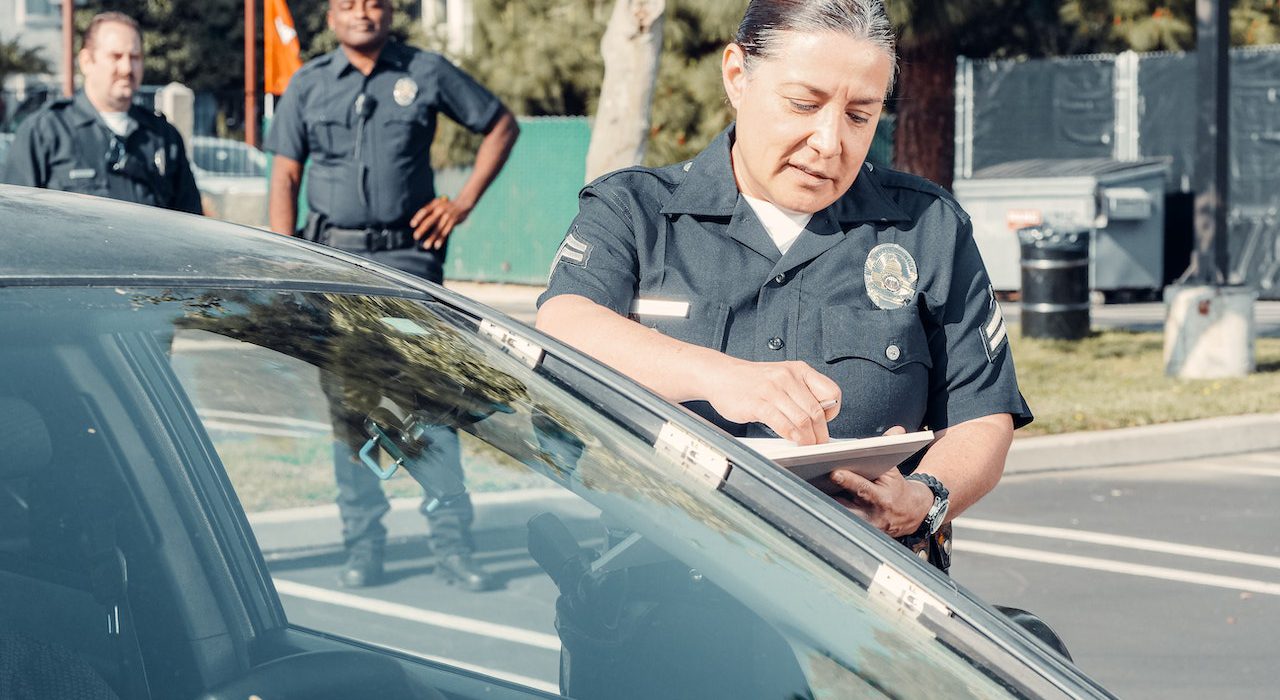 Police office at a car window