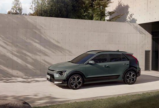 Kia Niro parked by a wall