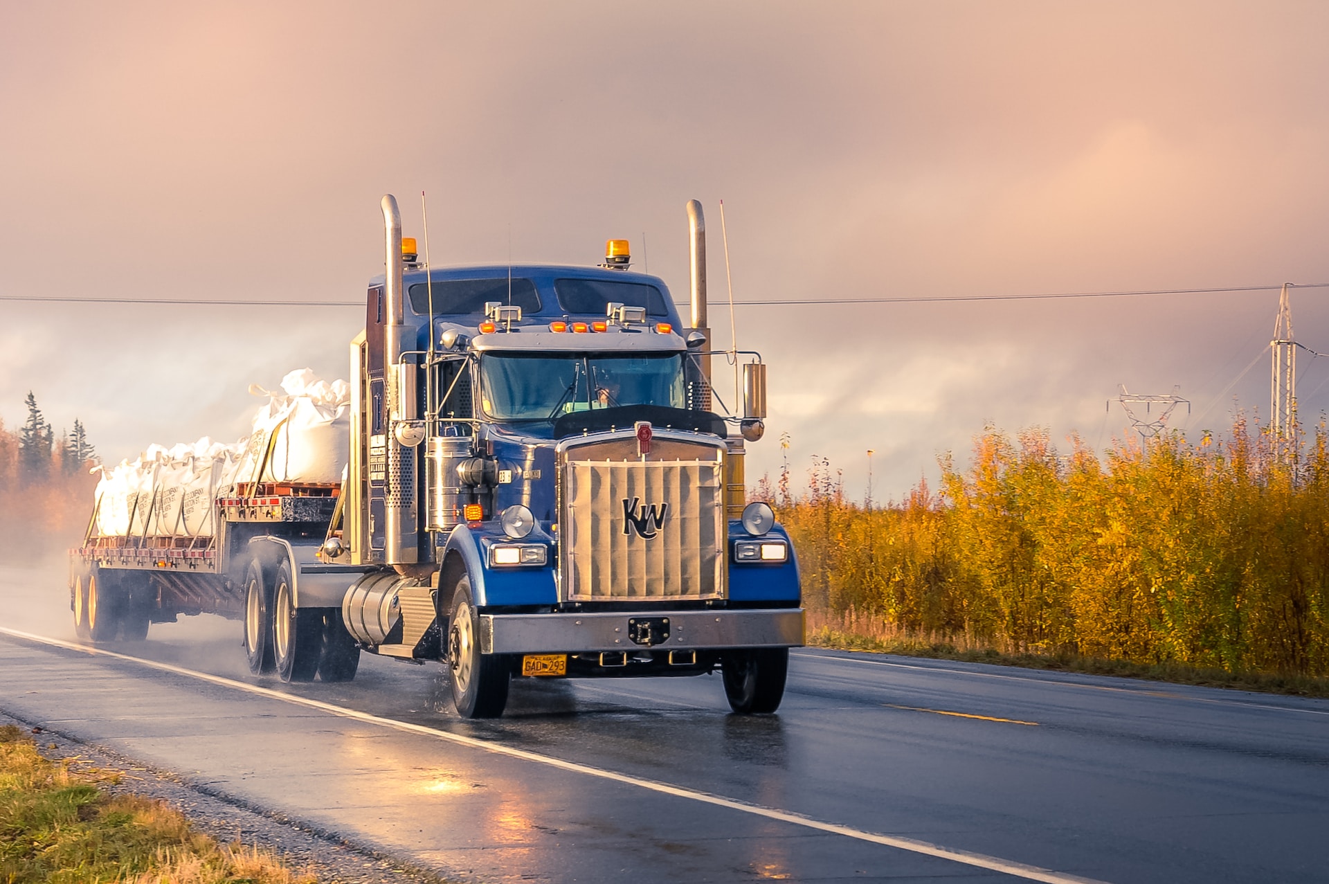 A semi-truck carrying bags.